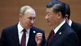 Russian President Vladimir Putin speaks with Chinese President Xi Jinping before an extended-format meeting of heads of the Shanghai Cooperation Organization summit (SCO) member states in Samarkand, Uzbekistan, September 16, 2022, photo by Sergey Bobylev/Pool via Reuters