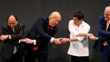 Vietnam's President Tran Dai Quang, U.S. President Donald Trump, President of the Philippines Rodrigo Duterte, and Australia's Prime Minister Malcolm Turnbull participate in the opening ceremony of the ASEAN Summit in Manila, Philippines, November 13, 2017, photo by Jonathan Ernst/Reuters