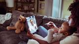 Close up of a mother and daughter consulting with their doctor over a video call on their digital tablet, photo by Geber86/Getty Images