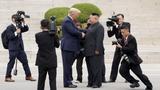  U.S. President Donald Trump meets with North Korean leader Kim Jong-un at the demilitarized zone in Panmunjom, South Korea, June 30, 2019, photo by Kevin Lamarque/Reuters