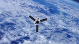 GPS or weather satellite orbiting Earth, photo by janiecbros/Getty Images