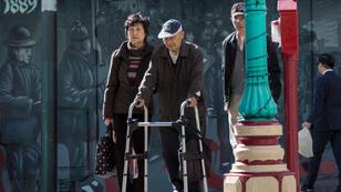 People walking outside in Chinatown, San Francisco, California, photo by Garden Photo World/Alamy
