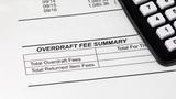 Closeup of a bank statement showing overdraft fee summary, photo by JJ Gouin/Getty Images