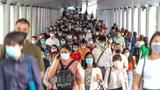 Crowd of unrecognizable people wearing surgical masks to prevent coronavirus in rush hour in Bangkok, Thailand, March 18, 2020, photo by Tzido/Getty Images