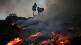 Smoke rises as a wildfire burns in Pacific Palisades, California, January 7, 2025, photo by Daniel Cole/Reuters
