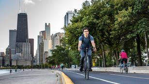 People cycling and jogging in Chicago by Michigan lake.