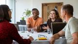 Group of young people at work, photo by SolStock/Getty Images