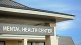 Mental health center sign on a building, photo by sshepard/Getty Images