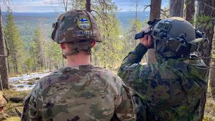 U.S. and Finnish soldiers view targets with binoculars from a forward observer post in Rovajärvi, Finland, May 17, 2024, photo by Sgt. 1st Class Nina Ramon/U.S. Army Reserve