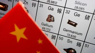 China's flag next to the periodic table showing gallium and germanium, July 6, 2023, photo by Florence Lo/Reuters