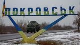A military vehicle passes by a road sign that reads &ldquo;Pokrovsk&rdquo; in the town of Pokrovsk, near a front line in the Donetsk region, Ukraine, December 19, 2024, photo by Alina Smutko/Reuters