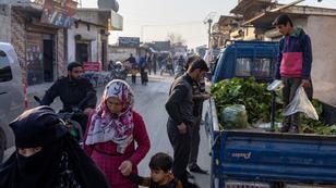 People walk along a street at a refugee camp in Idlib, Syria, December 17, 2024, photo by Umit Bektas/Reuters