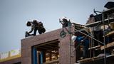 Construction workers at a residential property in Washington, D.C., August 25, 2022, photo by Graeme Sloan/Reuters