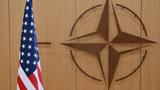 A U.S. flag and the NATO logo at NATO headquarters in Brussels, Belgium, February 17, 2025, photo. by Nicolas Tucat/Reuters