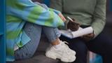 Closeup of stressed teenage girl talking to mental health therapist in session, photo by SeventyFour/Getty Images