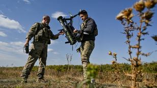 Ukrainian service members prepare to test an FPV drone with an attached portable grenade launcher in the Zaporizhzhia region, Ukraine, October 11, 2024, photo by Stringer/Reuters