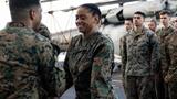 A marine with the 22nd Marine Expeditionary Unit, reenlists as a part of the Commandant’s Retention Program (CRP), hoto by Yvonna Guyette/U.S. Marine Corps