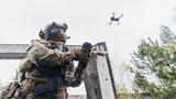 Soldier controls a drone, photo by parilov/Adobe Stock