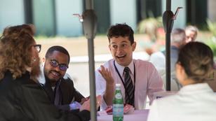 Students talk with faculty and board members at a luncheon, photo by Diane Baldwin/RAND Corporation
