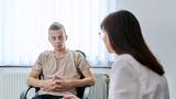 Counselor and young male person, photo by Valerii Honcharuk/Adobe Stock