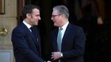 British Prime Minister Keir Starmer shakes hands with French President Emmanuel Macron at a summit on Ukraine at Lancaster House in London, UK, March 2, 2025, photo by Christophe Ena/Pool via Reuters