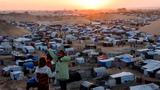 Displaced Palestinian children talk to each other as they shelter in a tent camp in Khan Younis, southern Gaza Strip, December 29, 2024, photo by Mohammed Salem/Reuters