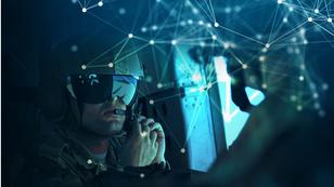 An airman with a glowing digital network, photo by Julianne Showalter/U.S. Air Force
