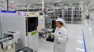 A worker at a factory that makes electronic products for new-energy vehicles, in a high-tech industrial park in Fengcheng, China, February 6, 2025, photo by Zhu Haipeng/VCG via Reuters