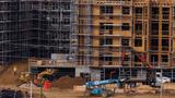 Construction workers build multifamily housing in San Diego, California, January 13, 2023, photo by Mike Blake/Reuters