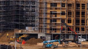 Construction workers build multifamily housing in San Diego, California, January 13, 2023, photo by Mike Blake/Reuters