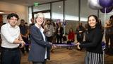 Nancy Staudt (center) cuts a ribbon, photo by Alexis Cohen/RAND