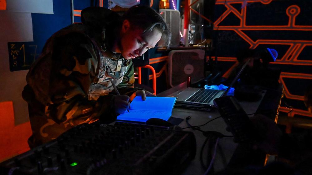 U.S. Air Force member takes notes during exercise