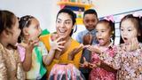 Pre-K teacher and her multiracial class react to a science experiment, photo by Vanessa Nunes/Getty Images