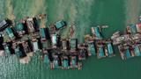 An aerial view of wooden pontoons equipped to dredge the seabed for deposits of tin ore off the coast of Toboali, on the island of Bangka, Indonesia, May 1, 2021, photo by Willy Kurniawan/Reuters