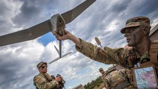 U.S. Army Corporal Matthew G. Mena from the New York Army National Guard, performs a systems check on an RQ-11 Raven B, a small unmanned aerial system, at Joint Base McGuire-Dix-Lakehurst, N.J., photo by Mark C. Olsen/NJ National Guard