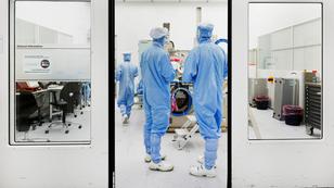 Assembly engineers work on a TWINSCAN DUV lithography system at ASML in Veldhoven, Netherlands, June 16, 2023, photo by Piroschka van de Wouw/Reuters