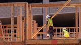 Construction employees work on a multifamily housing project in San Diego, California, September 19, 2023, photo by Mike Blake/Reuters