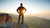 Silhouette of a man on top of a mountain, photo by Toltek/Getty Images