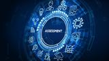 The word "Assessment" in the middle of a circle surrounded by icons depicting various types of assessments, photo by Photon_photo/Adobe Stock