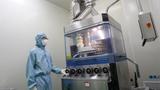 An employee producing biological drugs at a production workshop of a pharmaceutical company in Chongqing, China, March 6, 2024, photo by Costfoto/NurPhoto via Reuters