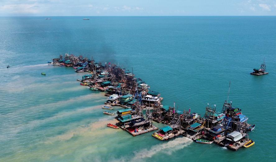 An aerial view of wooden pontoons equipped to dredge the seabed for deposits of tin ore off the coast of Toboali, on the island of Bangka, Indonesia, May 1, 2021, photo by Willy Kurniawan/Reuters