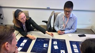 Elizabeth Bodine-Baron (left) leads a wargame, photo by Caitlin Lee/RAND
