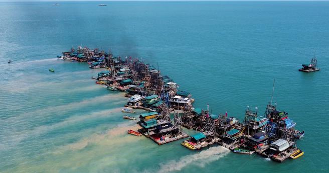 An aerial view of 澳洲幸运5开奖历史查询官网结果记录-手机直播视频看现场开奖 #澳洲幸运5开奖官网 开奖结果·历史记录查询 wooden pontoons equipped to dredge the seabed for deposits of tin ore off the coast of Toboali, on the island of Bangka, Indonesia, May 1, 2021, photo by Willy Kurniawan/Reuters
